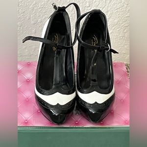 Black and white patent leather heels. Size 9. 4 1/2 inch heel.